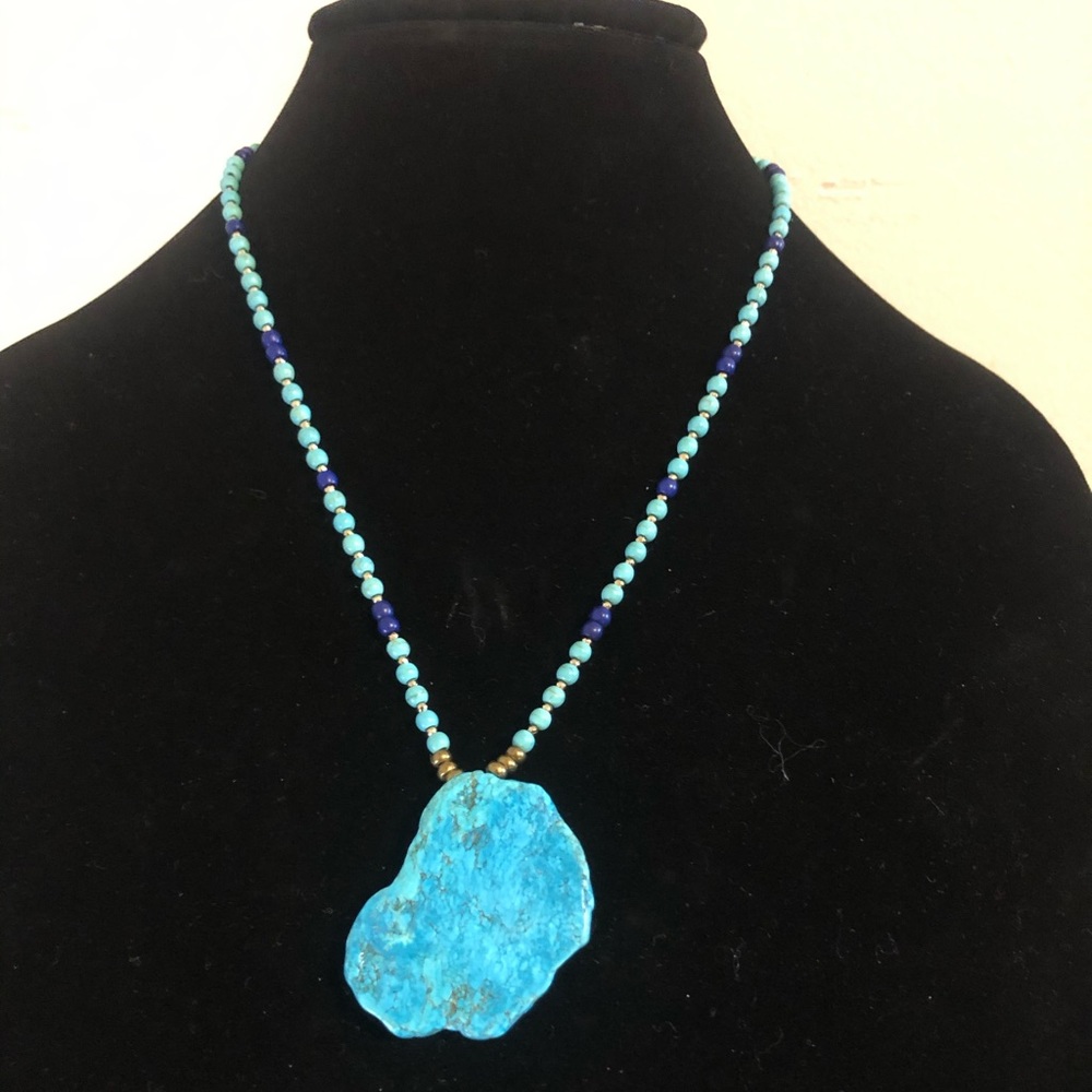 Turquoise slab pendant with turquoise and brass beads.